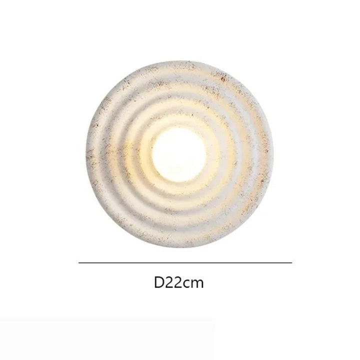 Ścienna lampa LED - okrągła forma z wzorem koncentrycznych pierścieni