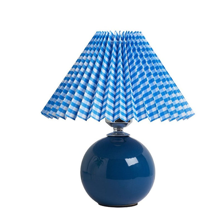 Lampa stołowa z ceramiczną podstawą i plisowanym abażurem
